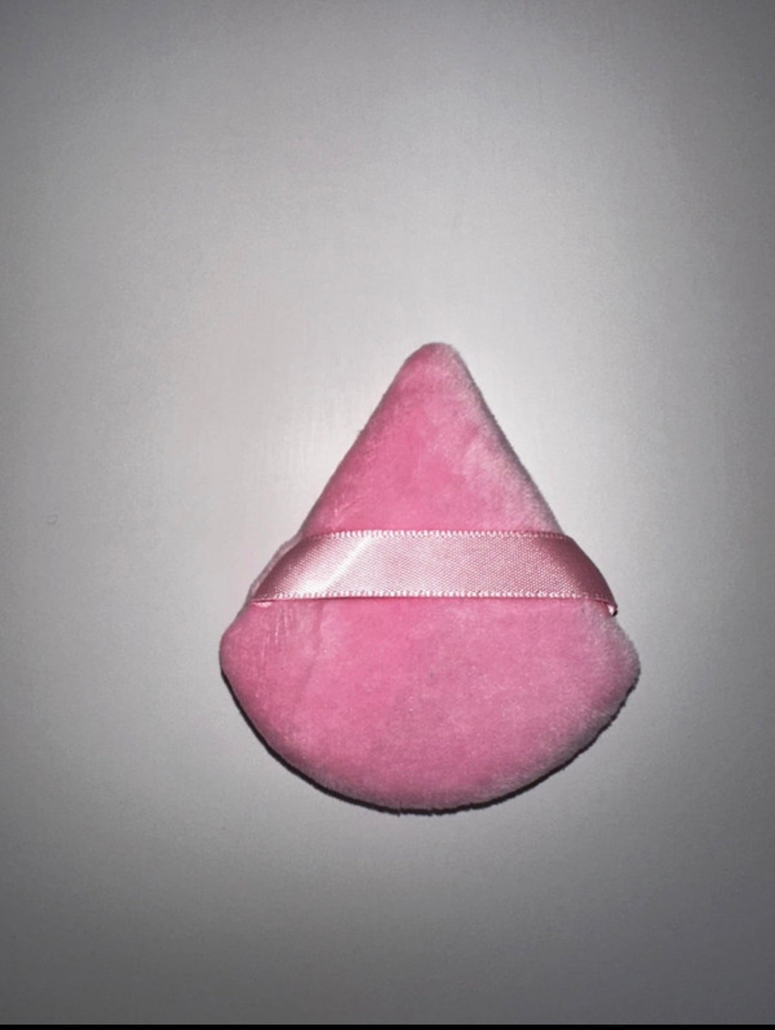 Triangular powder puffs