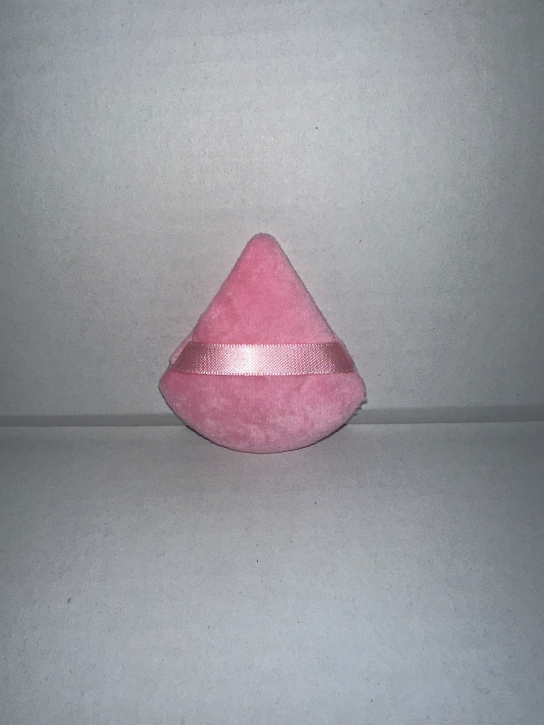 Triangular powder puffs