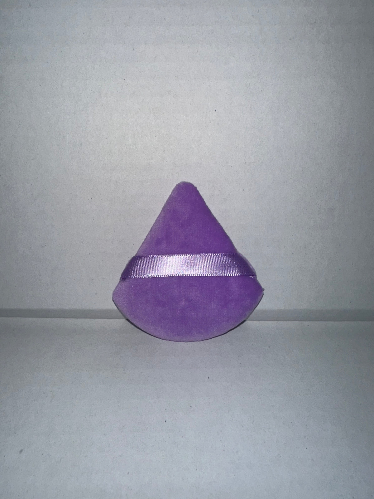 Triangular powder puffs