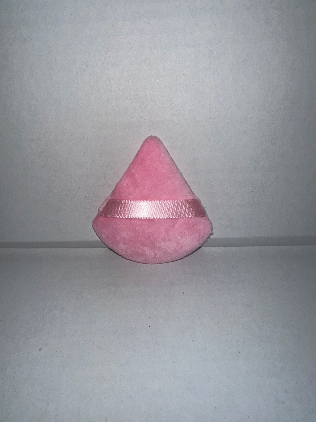 Triangular powder puffs