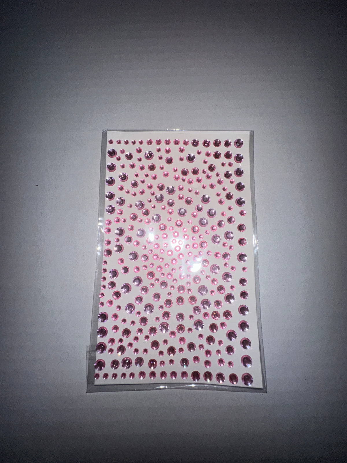 pink rhinestone stickers. Looks dazzling on your face.