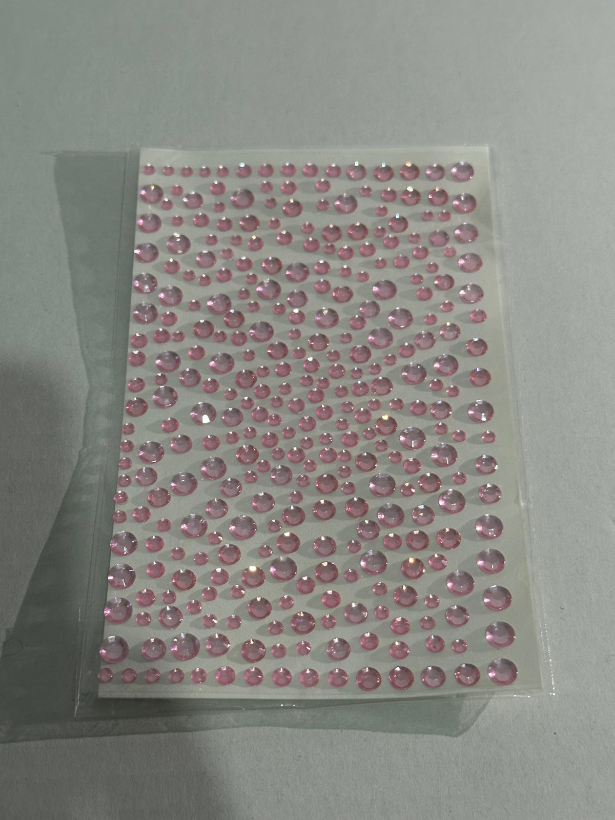 pink rhinestone stickers. Looks dazzling on your face.