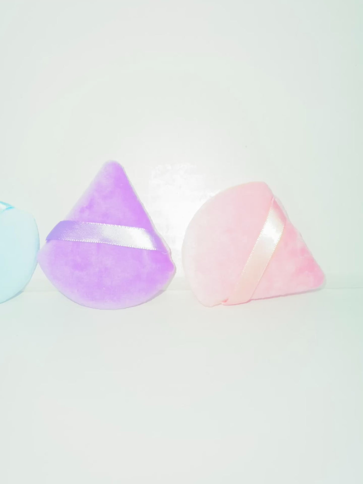 Triangular powder puffs